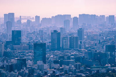 High angle view of buildings in city against sky