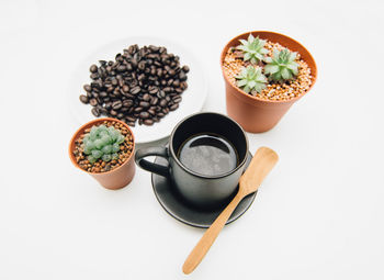 High angle view of coffee on table against white background