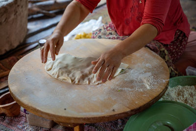 Midsection of man preparing food