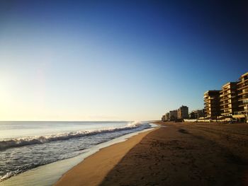 View of beach against clear sky