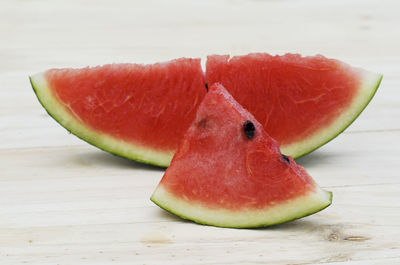 Delicious watermelon on wooden table for summer holidays backgrounds