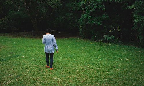 Rear view of man on grass