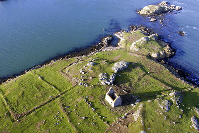 High angle view of sea by landscape