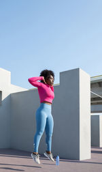 African american sportswoman doing squat thrust exercise