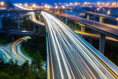 High angle view of light trails on bridge