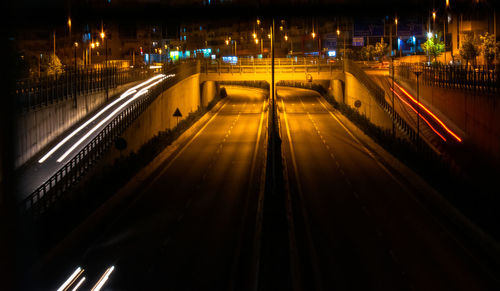 Light trails on street in city at night