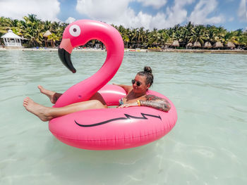 Pink toy floating on swimming pool