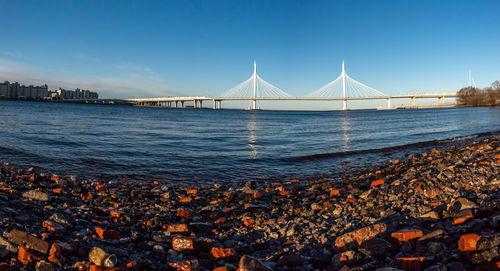 View of suspension bridge over sea