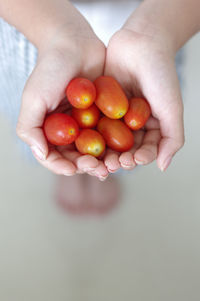 Close-up of hand holding strawberries