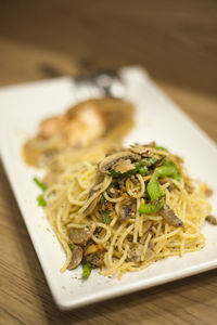 Close-up of noodles served in plate on table