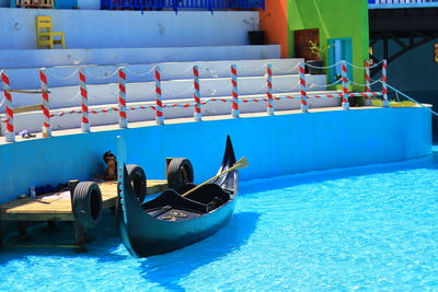 Boats moored in swimming pool