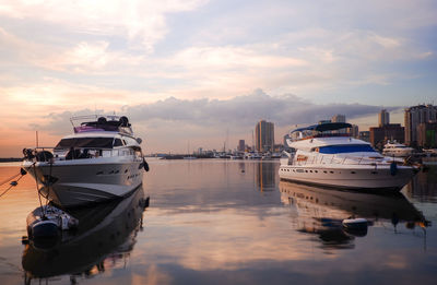 Boats moored at harbor