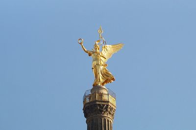 Low angle view of statue of liberty against sky