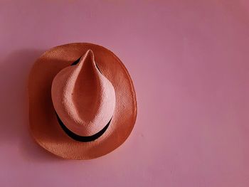 High angle view of hat on table against wall