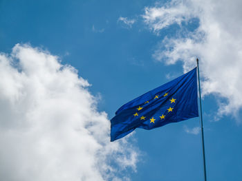 Low angle view of the european flag against blue sky