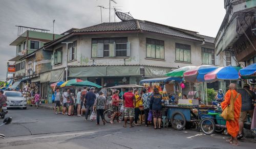 People at street market in city