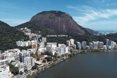 Aerial view of city and buildings against sky