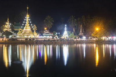 Reflection of illuminated buildings in water at night