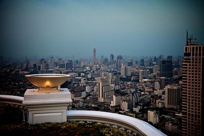 Modern buildings in city against clear sky