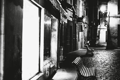 Empty alley amidst buildings in city