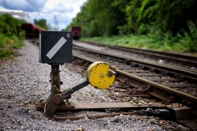 Rusty metal by railroad tracks