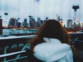 Woman looking at cityscape