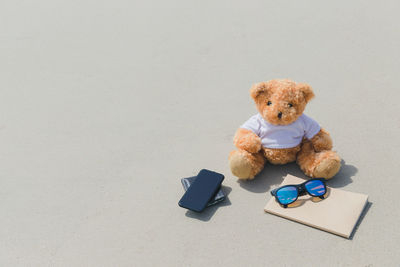 High angle view of stuffed toy against white background