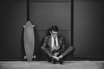 Portrait of young man sitting on seat