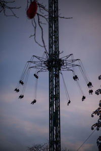 Low angle view of amusement park ride against sky