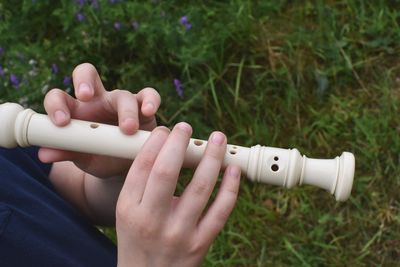 Close-up of woman hand holding flute