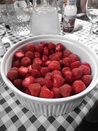High angle view of strawberries in bowl on table