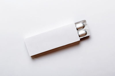 Close-up of usb stick against white background