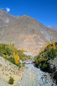 Scenic view of mountains against clear blue sky