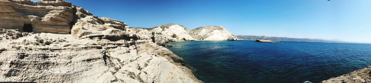 Scenic view of sea against clear blue sky