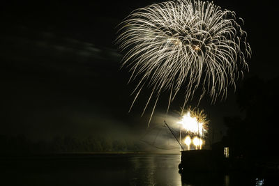 Firework display at night