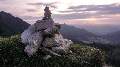 Scenic view of rocks against sky during sunset