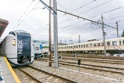 Train on railroad station platform against sky