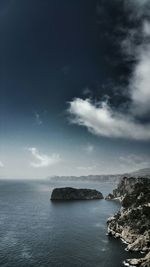 Scenic view of sea against cloudy sky