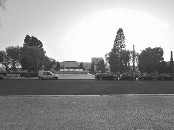 Cars on road against clear sky