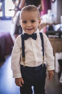 Portrait of smiling boy wearing suspenders