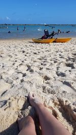 Low section of people on beach