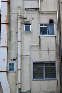 Low angle view of aging concrete residential building