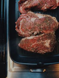 Close-up of meat on frying pan