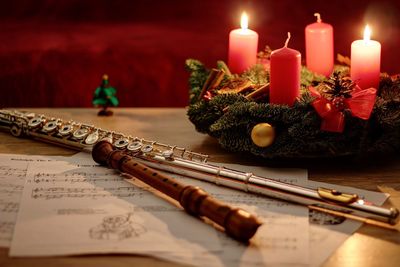 Close-up of flute with christmas decorations on table