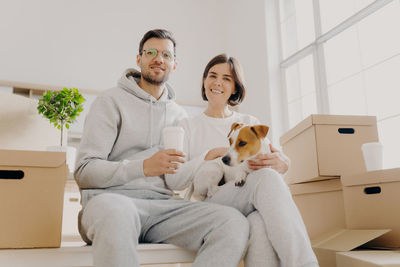 Portrait of couple sitting on table