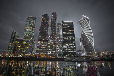 Illuminated buildings in city at night