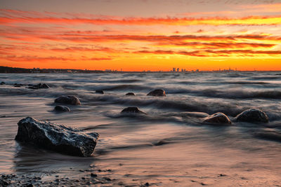 Scenic view of sea against sky during sunset