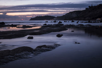 Scenic view of sea against sky at sunset