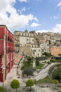 Buildings in town against cloudy sky, ragusa ibla