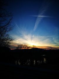 Silhouette of trees against sky during sunset